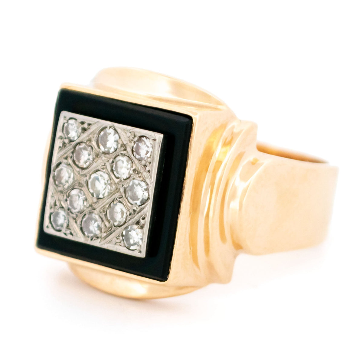 A yellow and white gold signet style ring with a square panel of black onyx and round diamonds