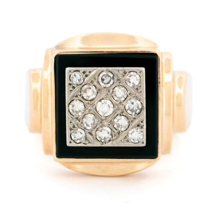 A yellow and white gold signet style ring with a square panel of black onyx and round diamonds