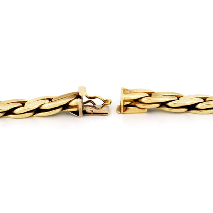 A yellow gold chain necklace, showing the clasp