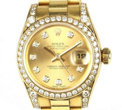Rolex Oyster Perpetual 26mm Datejust 18ct Yellow Gold and Diamond Ladies Automatic Wrist Watch, Model 179158, factory set diamond bezel and lugs, champagne dial, diamond dot hour markers, date aperture at 3, sapphire crystal, screw-down Rolex crown, 18ct Rolex President bracelet with a single deployment clasp. With Rolex Guarantee paperwork dated 2007. In a Rolex box