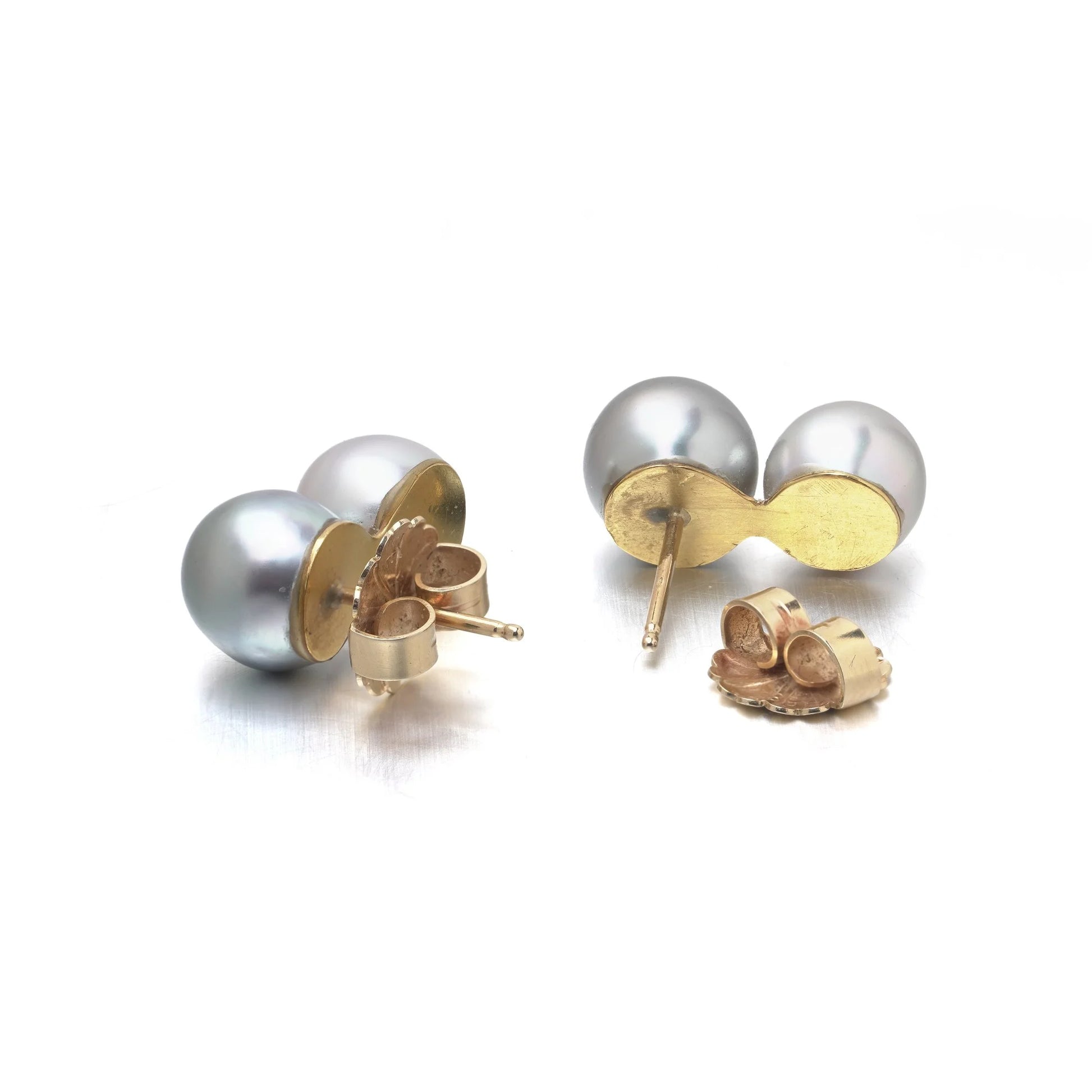 A pair of two stone grey and white pearl drop earrings in yellow gold