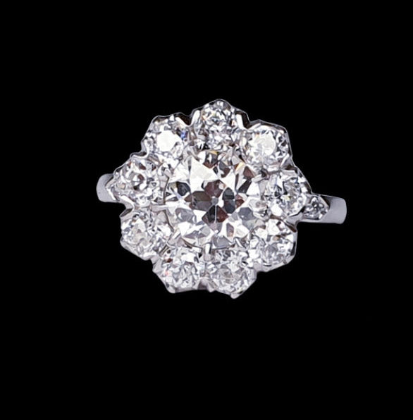 Old Cut Diamond Cluster Ring in Platinum; set with 3.50 carats of old cut diamonds, claw set with a low profile to the finger, colour H, clarity VS2