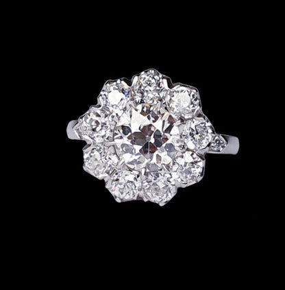 Old Cut Diamond Cluster Ring in Platinum; set with 3.50 carats of old cut diamonds, claw set with a low profile to the finger, colour H, clarity VS2