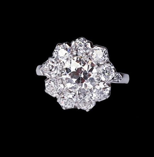 Old Cut Diamond Cluster Ring in Platinum; set with 3.50 carats of old cut diamonds, claw set with a low profile to the finger, colour H, clarity VS2