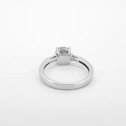 1.16ct Diamond Solitaire Engagement Ring with Baguette Diamond Shoulders; featuring a 1.16 carat round brilliant cut diamond, four-claw set in platinum, flanked by two tapered baguette diamonds on the shoulders