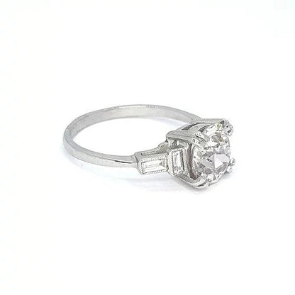 2.16ct Diamond Solitaire Engagement ring, baguette-cut diamond set shoulders, mounted in platinum