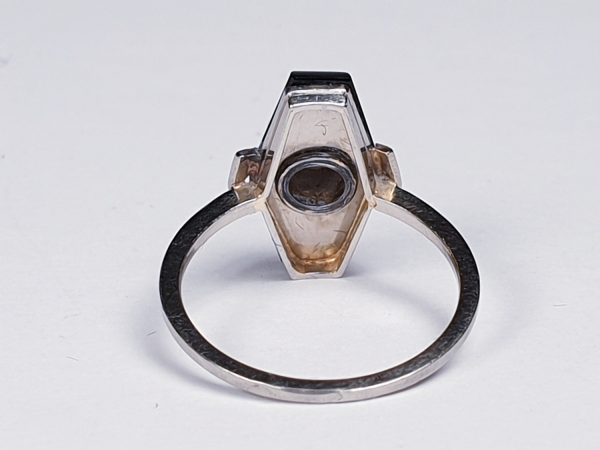 Art Deco French Old Cut Diamond and Onyx Lozenge Plaque Ring; hexagonal ring with central 0.25ct old cut diamond on a matt ground with a fine onyx border. Set in white gold, Circa 1925