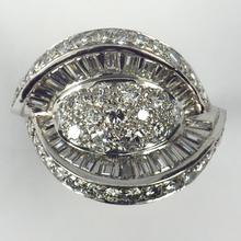 Retro Diamond and Platinum Cocktail Ring; designed as a dome with curved and flaring ridges, set with 2.55 carats round brilliant cut and baguette diamonds