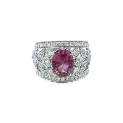 3.19ct Padparadscha Sapphire and Diamond Dress Ring by David Jerome; the central, unheated 3.19 carat oval faceted padparadscha sapphire is nestled upon a wide floral openwork band set with 1.56 carats of sparkling white diamonds, in 18ct white gold