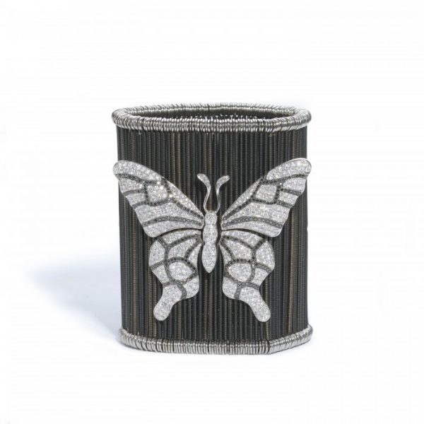 Diamond Butterfly and Ladybird Cuff Bracelet; anodised white gold twisted bars on sprung fittings, with a large white and black brilliant-cut diamond-set butterfly and two smaller ladybirds set with white and black brilliant-cut diamonds, 9.00 carat total