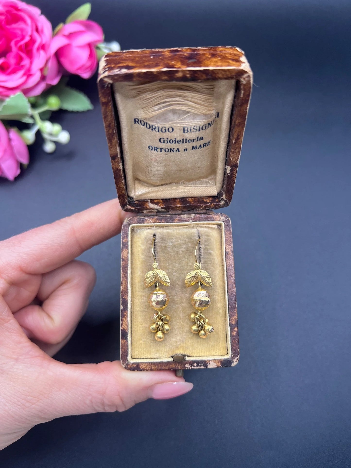 A pair of yellow gold leaf and faceted ball drop earrings with hook fittings, in an antique box