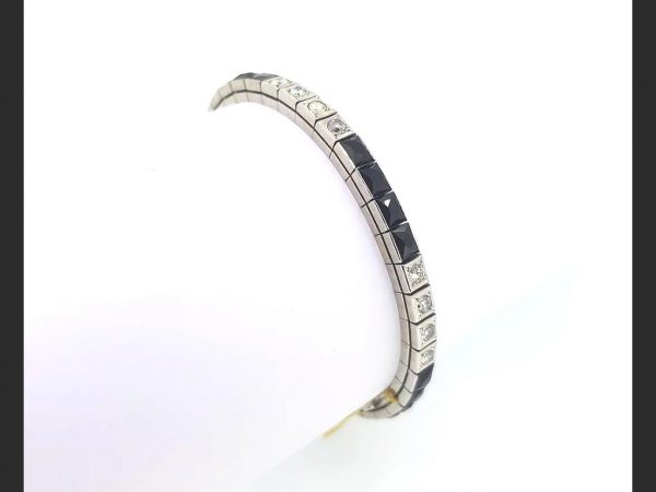 Onyx and diamond line bracelet, circa 1930, diamonds totaling 2.00 carats, 14ct white gold