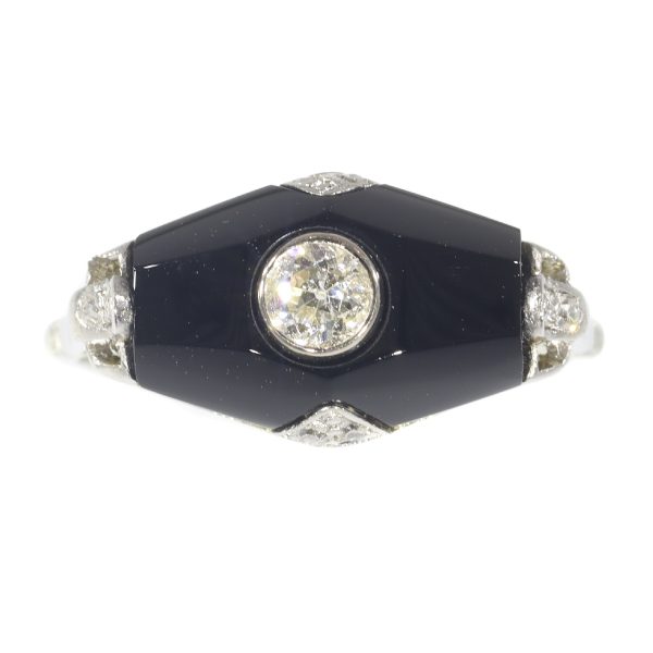 Art Deco diamond and onyx ring in white gold.