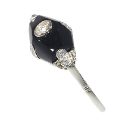 Art Deco diamond and onyx ring in white gold.