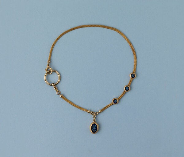 Antique Victorian Forget-Me-Not and 18ct Yellow Gold Locket Chain Pendant Necklace; 18ct yellow gold woven watch chain with three slides and a locket with two compartments decorated with forget-me-nots on both sides. France, 19th century