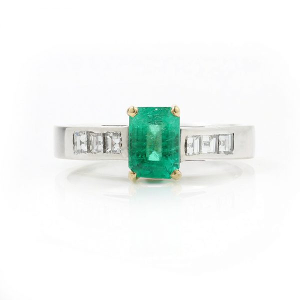 Vintage Emerald Cut Colombian Emerald and Diamond Ring; central 0.90ct certified Colombian emerald-cut emerald flanked by princess-cut diamond set shoulders, in 18ct white gold. Circa 1980s-1990s. With GCS certificate