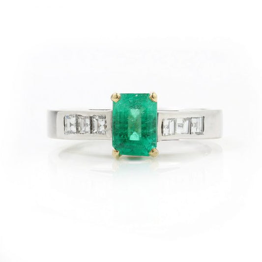 Vintage Emerald Cut Colombian Emerald and Diamond Ring; central 0.90ct certified Colombian emerald-cut emerald flanked by princess-cut diamond set shoulders, in 18ct white gold. Circa 1980s-1990s. With GCS certificate