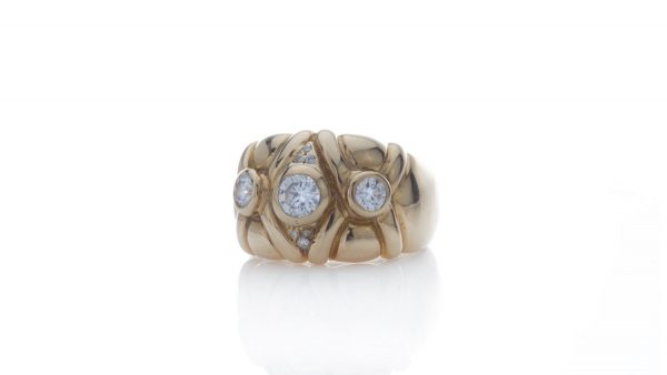 Vintage French Three Stone Diamond Ring in 18ct Yellow Gold; high end designer style, 0.73 carat total, Hallmarked with eagles head, Circa 1970s