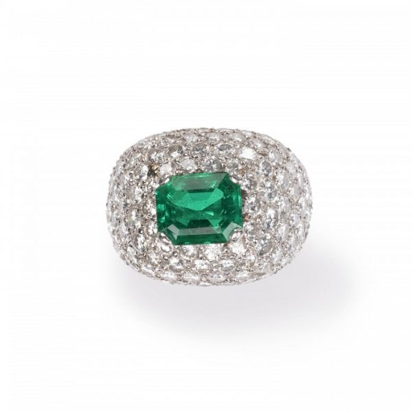 Emerald and Diamond Bombe Cluster Ring, central 2.40ct emerald-cut emerald surrounded by 6cts of brilliant-cut diamonds in a pavé setting, in 18ct white gold