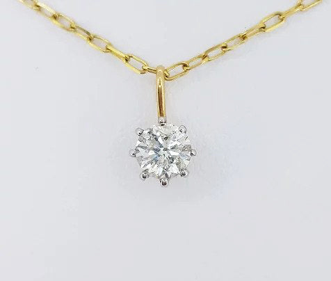 0.75ct Diamond Solitaire Pendant, single 0.75 carat round brilliant-cut diamond, claw set and suspended on a chain, in 18ct yellow gold.