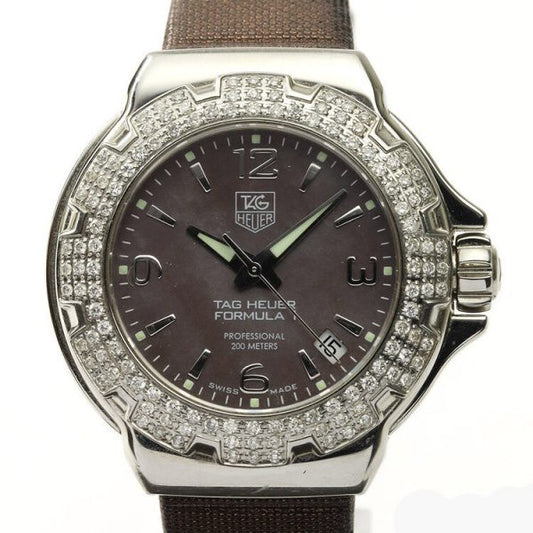 Tag Heuer Formula 1 Ladies Sparkling Diamond Bezel Mother of Pearl Dial Watch; Ref. WAC1217, 36mm stainless steel case with original diamond bezel, brown mother of pearl dial, four Arabic numerals, date indicator, screwdown crown and sapphire crystal, Quartz movement, on a TAG Heuer brown satin/leather strap with Tag Heuer buckle