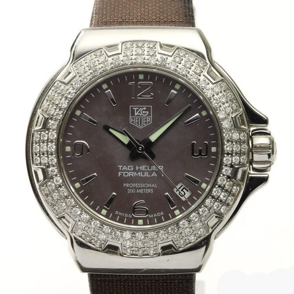 Tag Heuer Formula 1 Ladies Sparkling Diamond Bezel Mother of Pearl Dial Watch; Ref. WAC1217, 36mm stainless steel case with original diamond bezel, brown mother of pearl dial, four Arabic numerals, date indicator, screwdown crown and sapphire crystal, Quartz movement, on a TAG Heuer brown satin/leather strap with Tag Heuer buckle