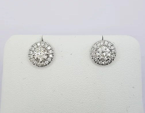 Diamond Cluster Stud Earrings; central brilliant cut diamonds, four-claw set, surrounded by a halo of diamonds, 0.94 carats, 18ct white gold