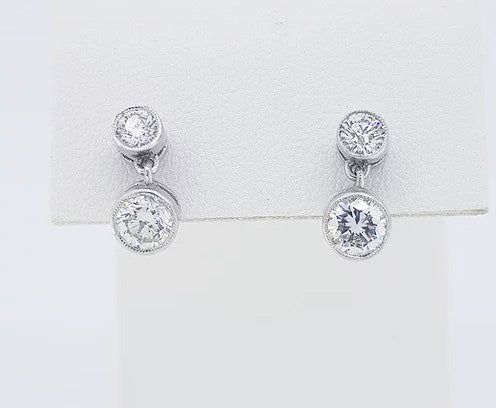 1.10ct Diamond Drop Earrings; featuring brilliant cut diamonds suspended from a diamond set stud, 1.10 carat total, in 18ct white gold