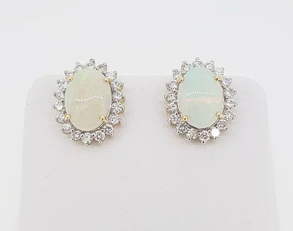 Opal and Diamond Oval Cluster Stud Earrings; featuring 4.00cts oval cabochon opals surrounded by sparkling diamonds, claw set in 18ct gold