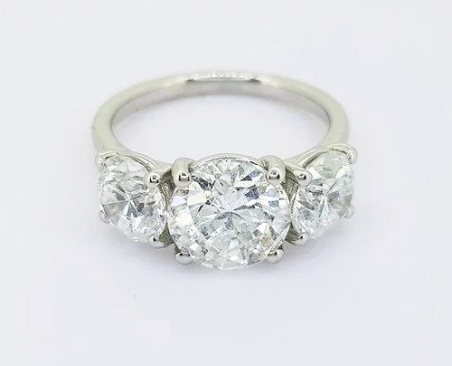 4.04ct Diamond Three Stone Ring; classic diamond trilogy ring, central round brilliant cut 2.02ct diamond flanked by 2.04cts diamonds, 18ct white gold.