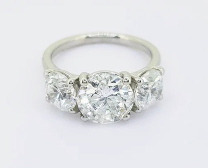 4.04ct Diamond Three Stone Ring; classic diamond trilogy ring, central round brilliant cut 2.02ct diamond flanked by 2.04cts diamonds, 18ct white gold.
