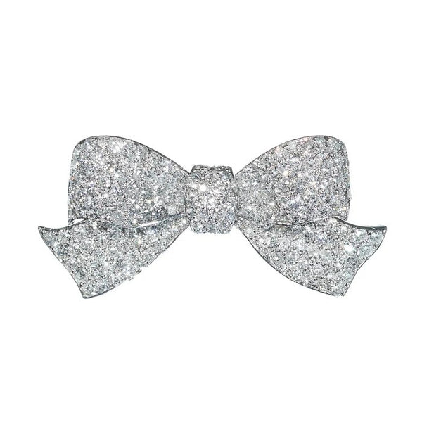 Art Deco 2.91ct Old Cut Diamond Bow Brooch in Platinum, finely pave set with 2.91 carats of old style eight-cut diamonds, with a white gold pin and roller catch. Circa 1925