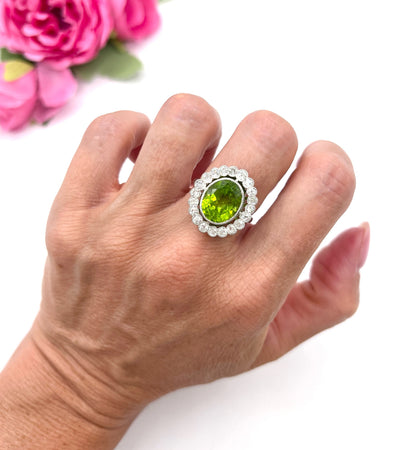 Antique French Platinum Peridot and Diamond Halo Cluster Ring, Circa 1910