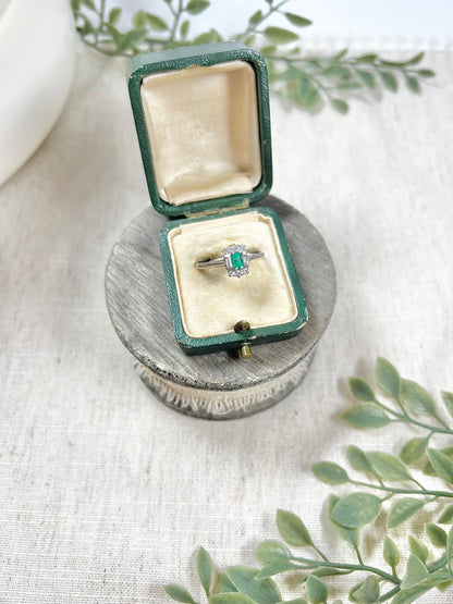 Vintage 18 Carat White Gold Emerald Cut Emerald and Diamond Cluster Ring, Circa 1940