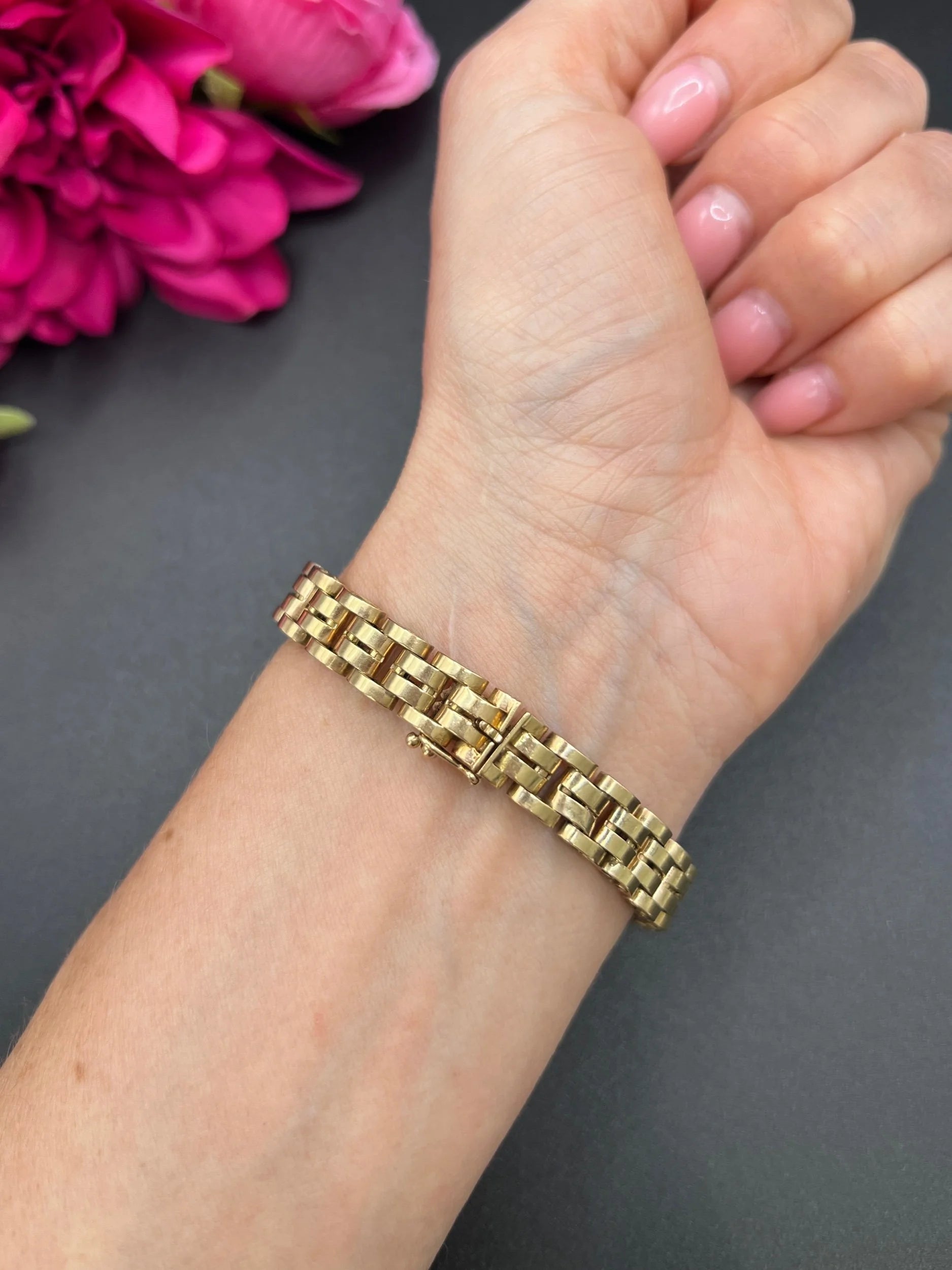 A yellow gold link bracelet, modelled on a wrist