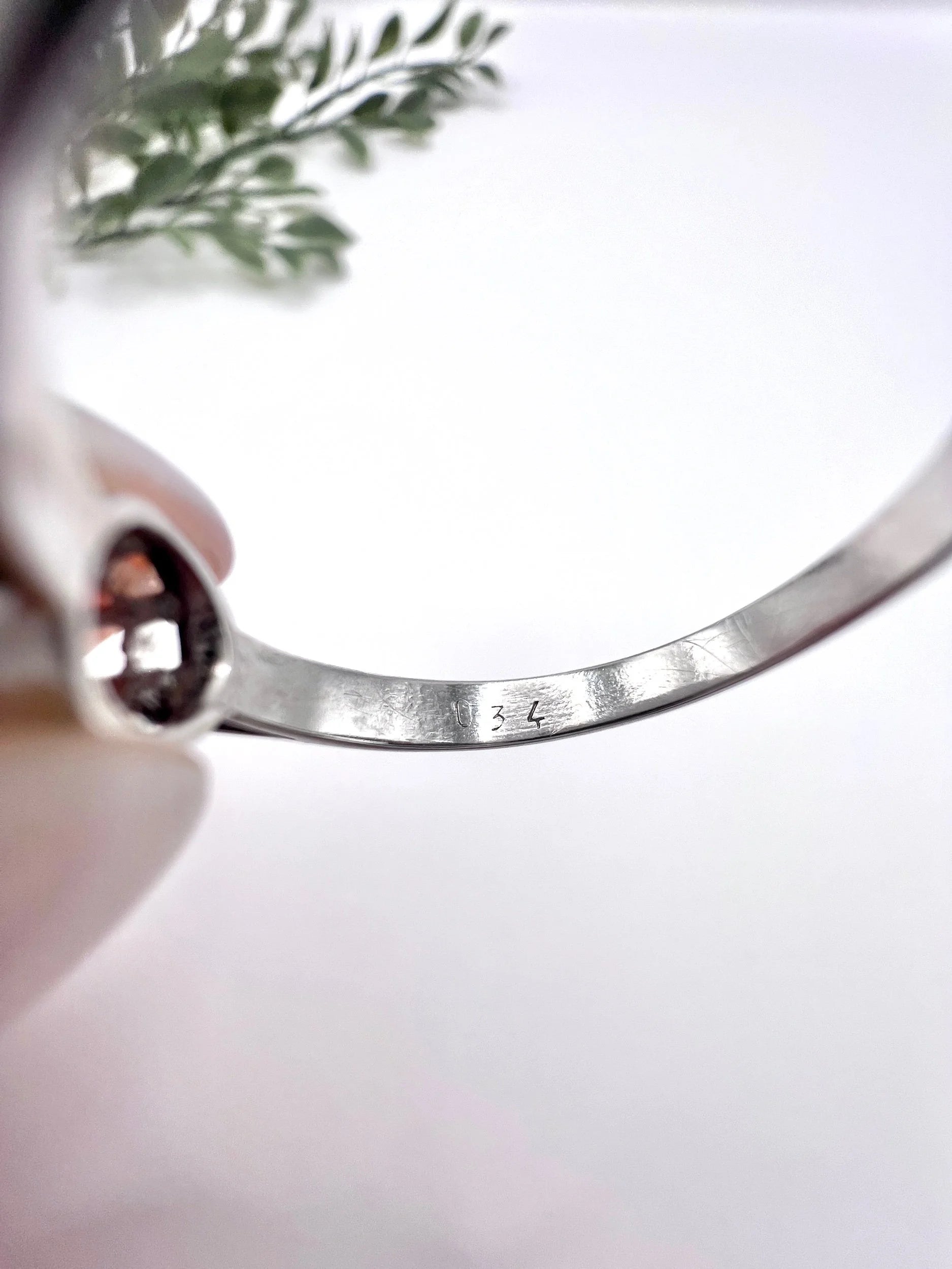 A solitaire round diamond ring in white gold