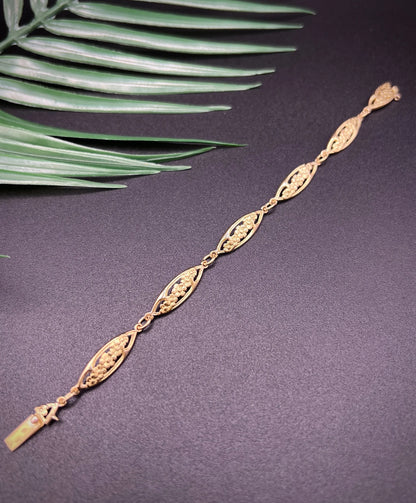 A yellow gold floral link bracelet
