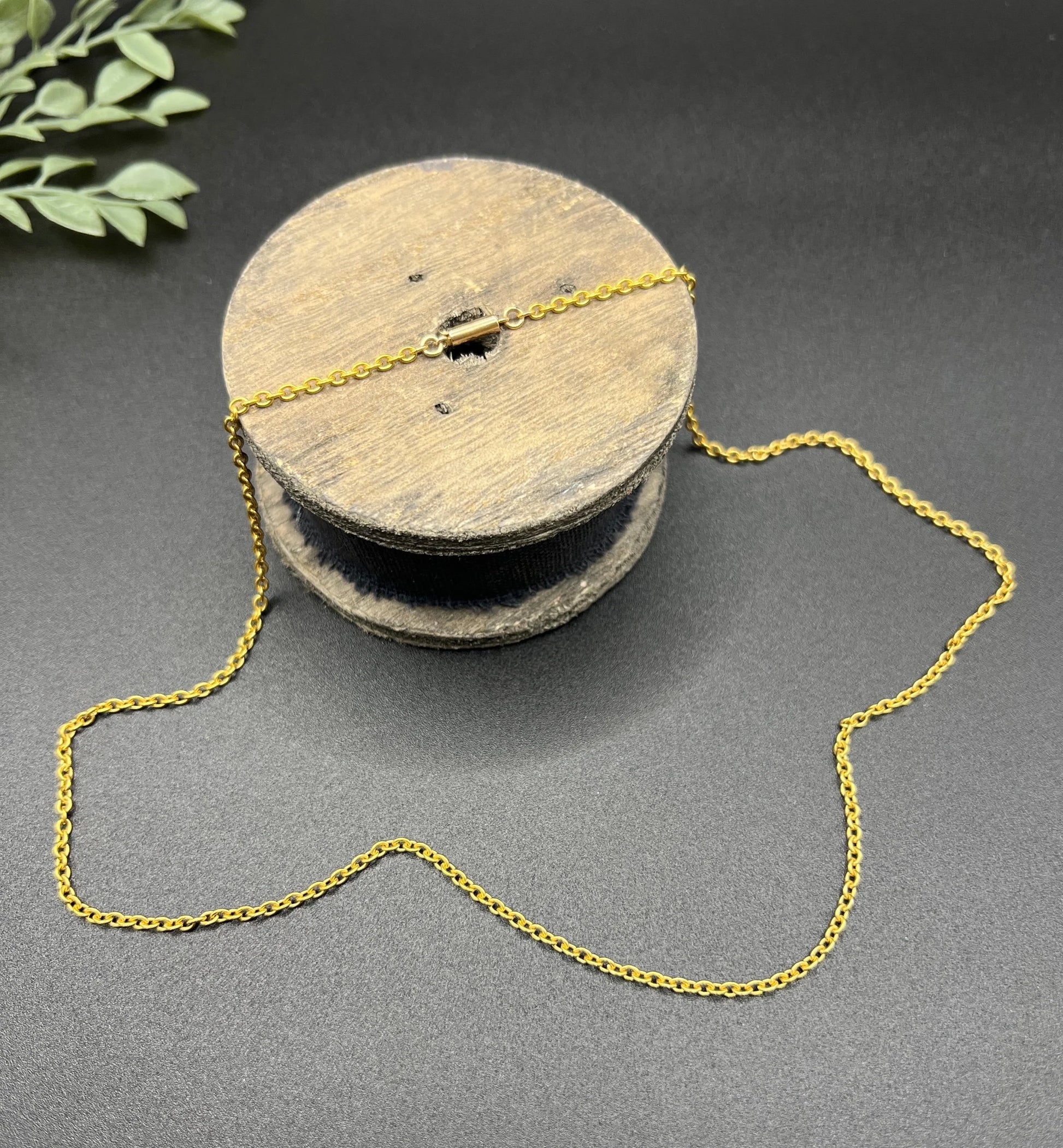 A yellow gold trace link chain necklace