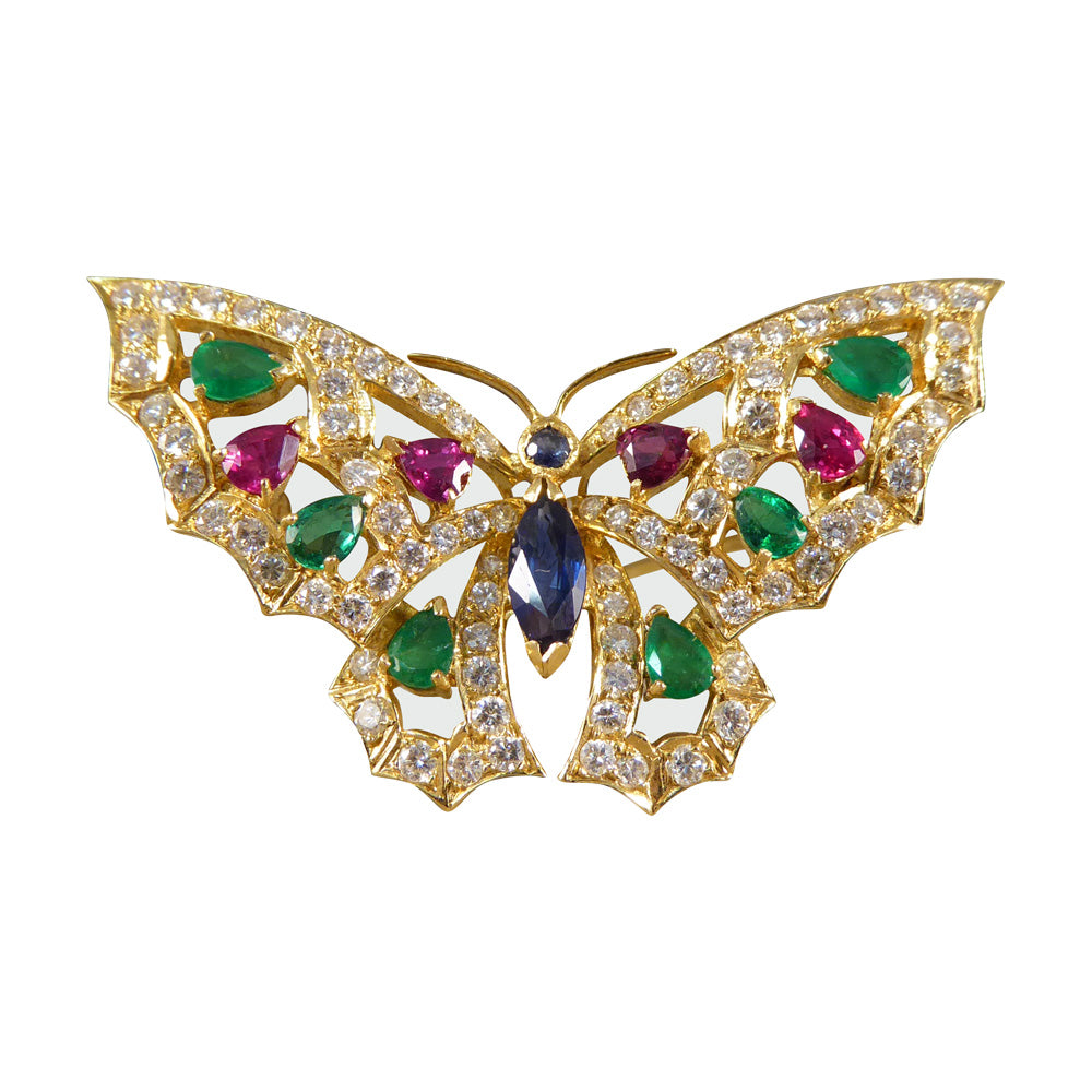 Contemporary diamond emerald ruby and sapphire butterfly brooch in 18ct gold