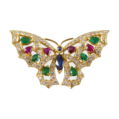 Contemporary diamond emerald ruby and sapphire butterfly brooch in 18ct gold