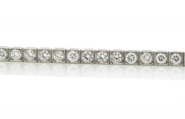 Cartier Vintage Diamond and Platinum Tennis Bracelet, 5.25 carat total, with Cartier box. Circa 1950s