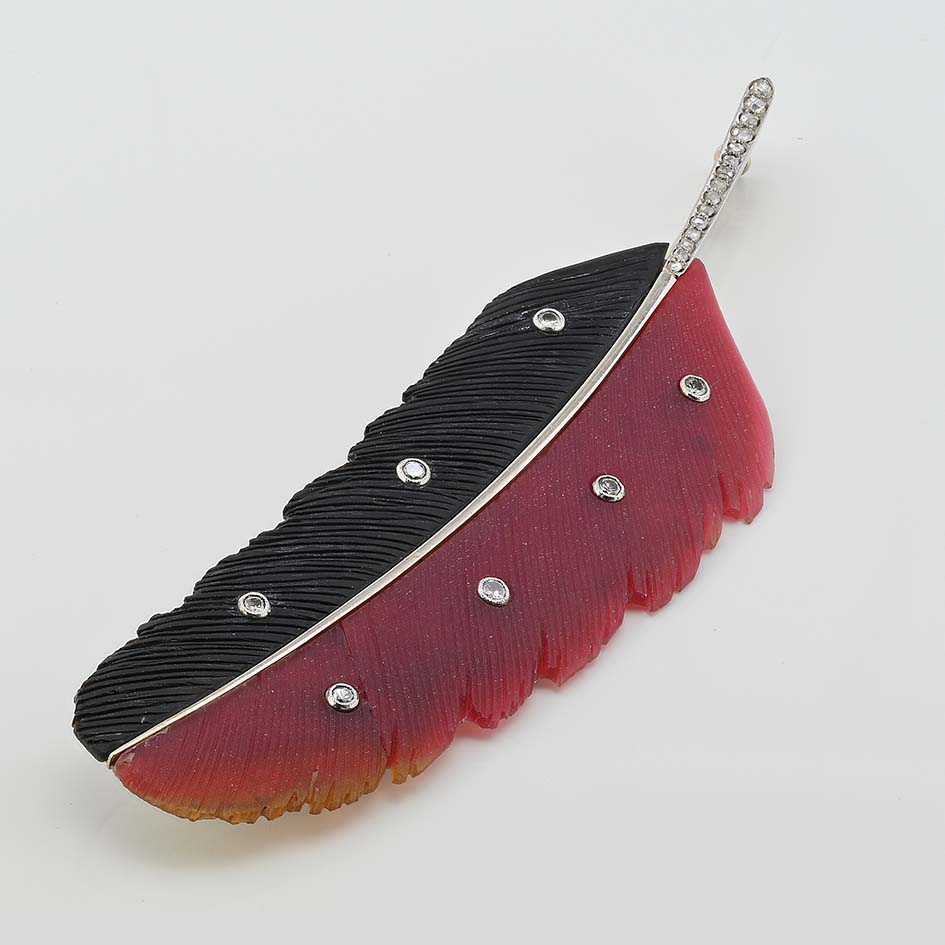 Art Deco Paltscho Vienna Red Chalcedony Black Onyx and Diamond Feather Brooch, carved red chalcedony and black onyx feather with diamond dots and rose-cut diamonds along the stem in 14ct white gold. Circa 1920. With Austro Hungarian marks of the period - Signed Ges. Gesh. (copyright) E. PALTSCHO – WIEN – KARLSBAD N. 29