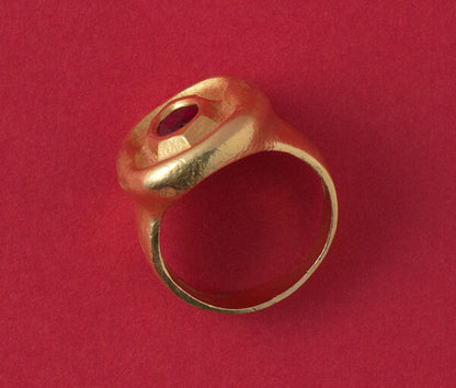Art Deco Hammered Gold Ring with Ruby; hammered gold anthroposophical ring set with a 1.40ct oval natural untreated bright red Cambodian ruby, from the Steiner workshops during Karl Mohr’s supervision