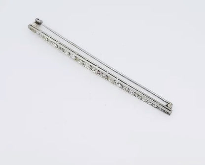 Antique Edwardian 2.20ct Diamond and Platinum Bar Brooch; set with 2.20 carats graduating diamonds, 5.5cm long.