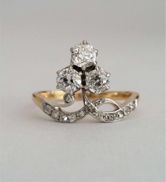 Antique Edwardian Old Cut Diamond Trefoil Cluster Ring; 'Duchesse' ring, with three old cut diamonds, 0.20cts each, rose-cut diamond accents