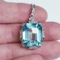 Antique Aquamarine and Diamond Pendant in Platinum; featuring a 22.50 carat octagonal step-cut aquamarine decorated with diamond set scrolls around the platinum setting