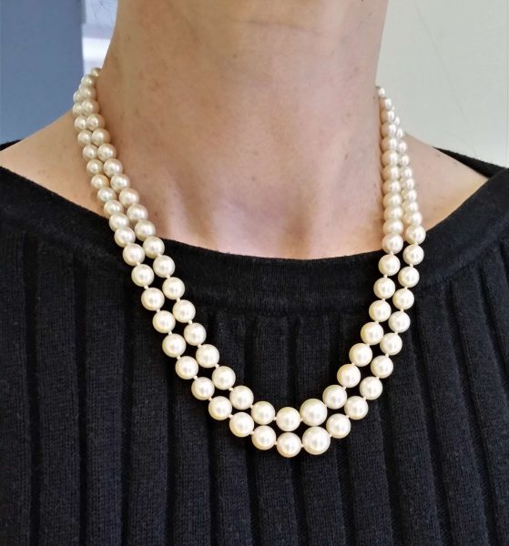 Vintage Akoya Pearl Two Row Necklace with Diamond Clasp; graduated double row of Akoya cultured pearls on a platinum and white gold clasp set with 0.25cts old cut diamonds, Circa 1940s