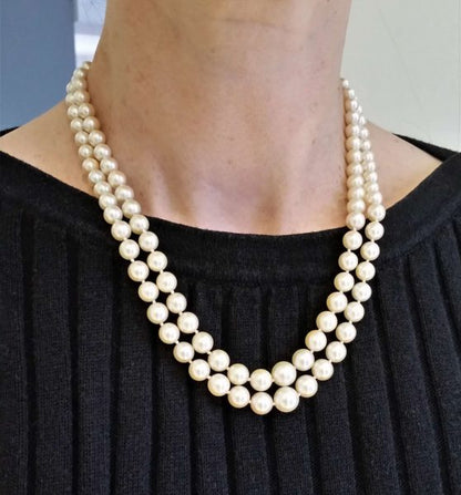 Vintage Akoya Pearl Two Row Necklace with Diamond Clasp; graduated double row of Akoya cultured pearls on a platinum and white gold clasp set with 0.25cts old cut diamonds, Circa 1940s