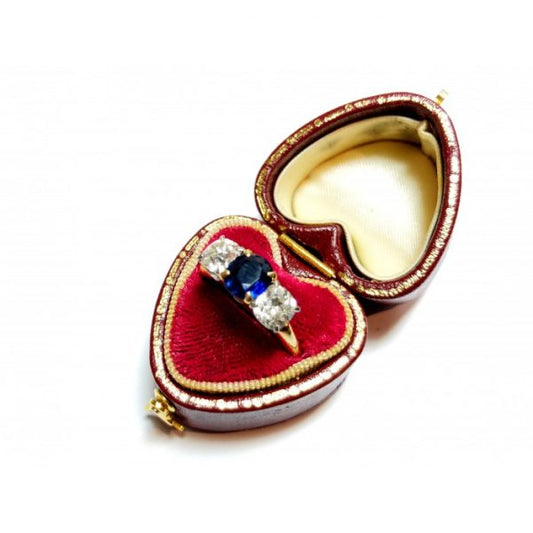 Vintage Sapphire and Old Cut Diamond Three Stone Ring, central 1.17ct sapphire flanked by old-cut diamonds, mounted in 14ct yellow gold, with white gold settings, Circa 1960