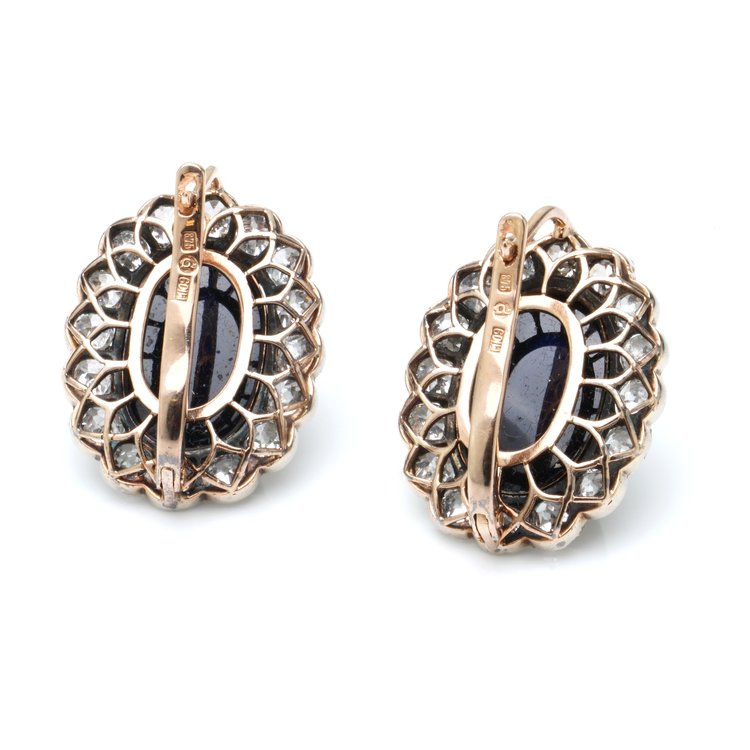 Antique Russian Cabochon Sapphire and Old Cut Diamond Cluster Earrings; 12cts cabochon blue sapphires surrounded by 6.40cts old-cut diamonds, in 14ct yellow gold with post and clip fittings, Circa 1850s
